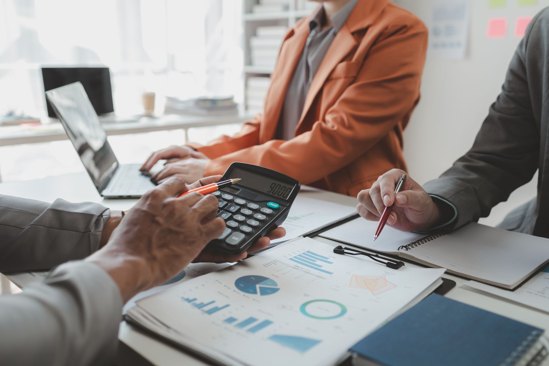 A woman is wearing a virtual reality headset and headphones.