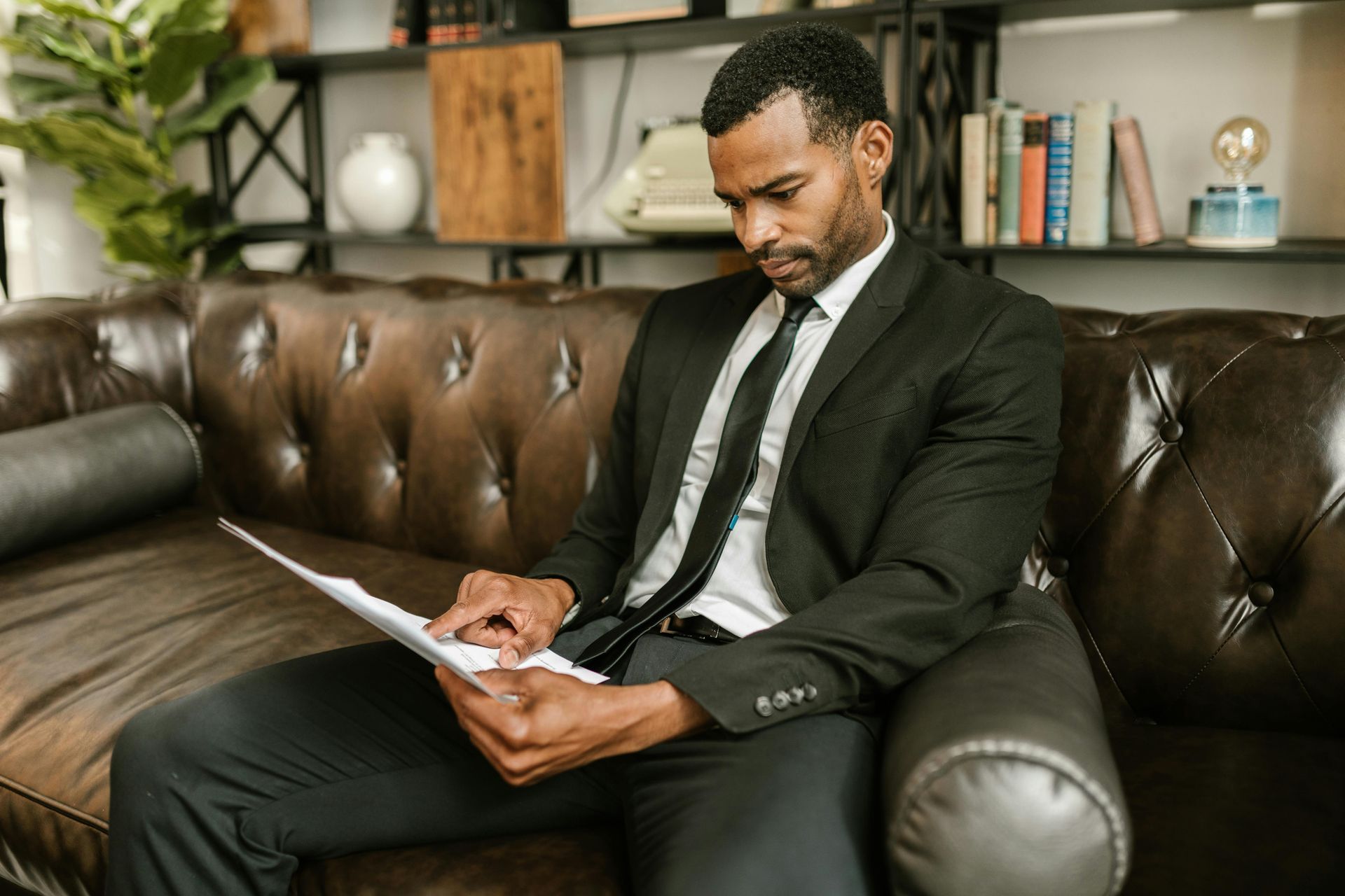 Business owner reviewing financial reports and bookkeeping records