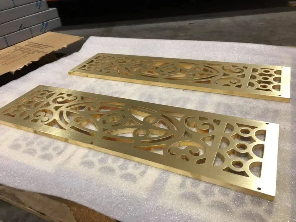 brass metal parts with patterns cut by Hygrade Laser
