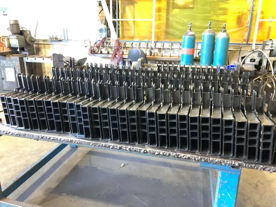 Metal pieces that have been precision fabricated, laser cut, bent,  and welded.