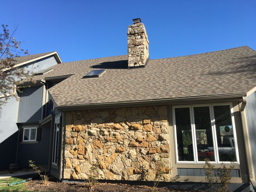 Brown Asphalt Roofing with Chimney — Lee's Summit, MO — Home Property Solutions