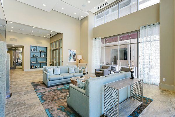 Clubhouse filled with furniture and a large window.