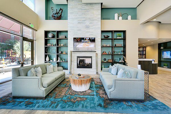 Clubhouse filled with furniture and a fireplace.