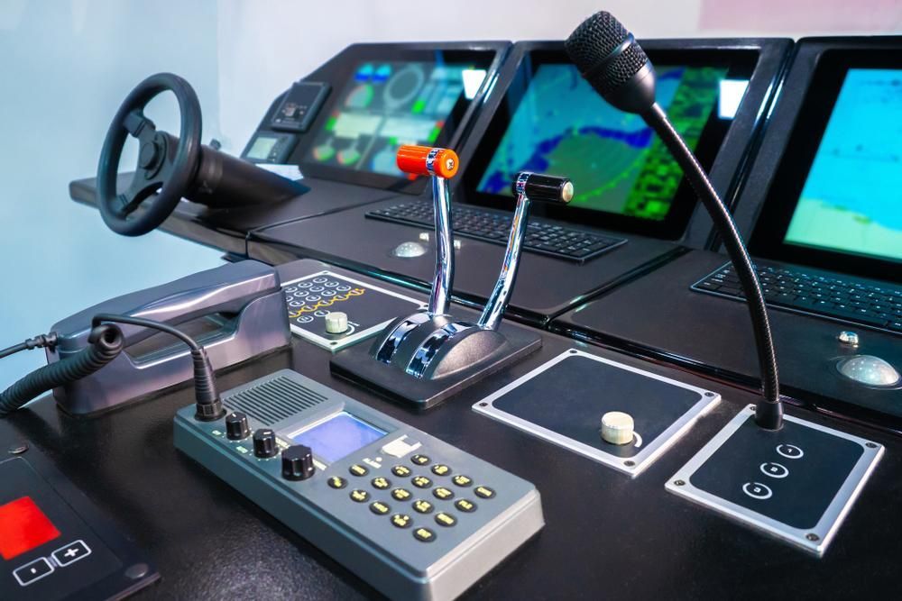 A Control Panel With A Steering Wheel And A Microphone On It — PASMA Electrical In Weipa, QLD