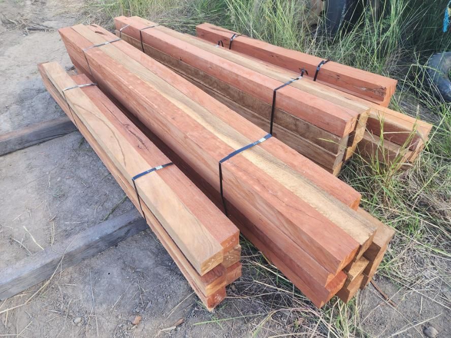 A Large Pile of Logs is Sitting in the Middle of a Forest — Mackay Hardwood Sales in Freshwater Point, QLD
