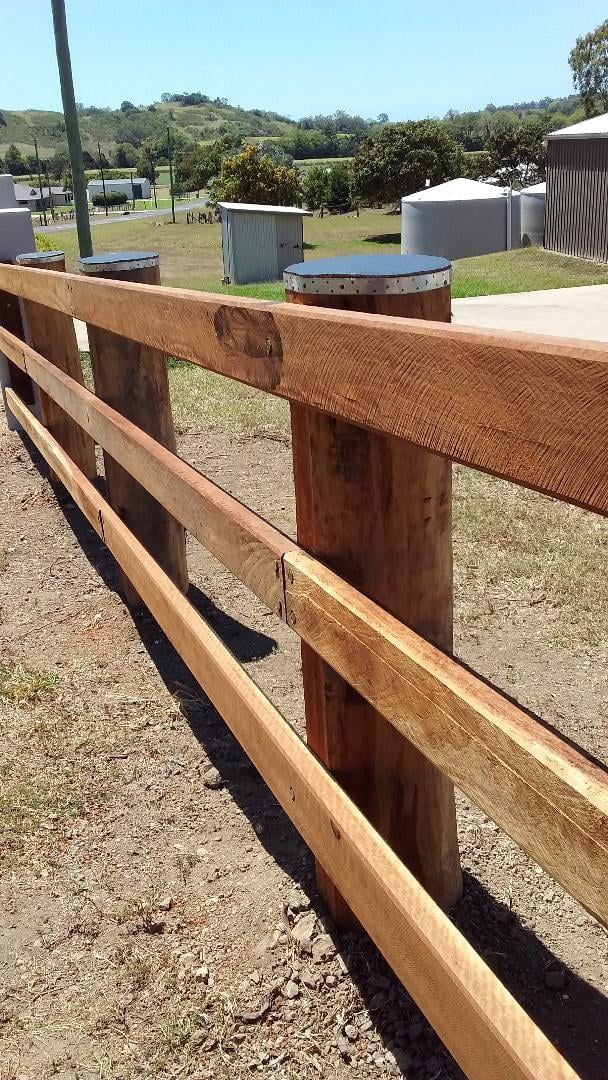 A Wooden Fence with Open Poles— Mackay Hardwood Sales in Freshwater Point, QLD