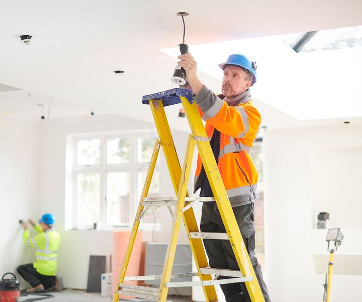 Electrician Installing Downlights — McDonough, GA — Pike Electrical Solutions