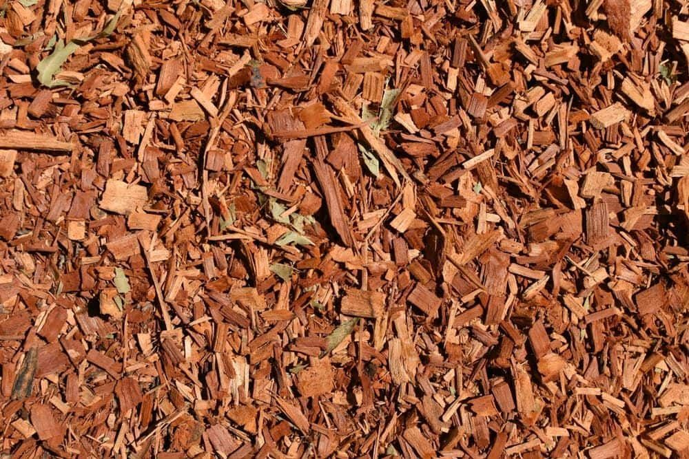 A Pile Of Brown Wood Chips On The Ground — JMAK Haulage & Landscapes Supplies In Falls Creek, NSW