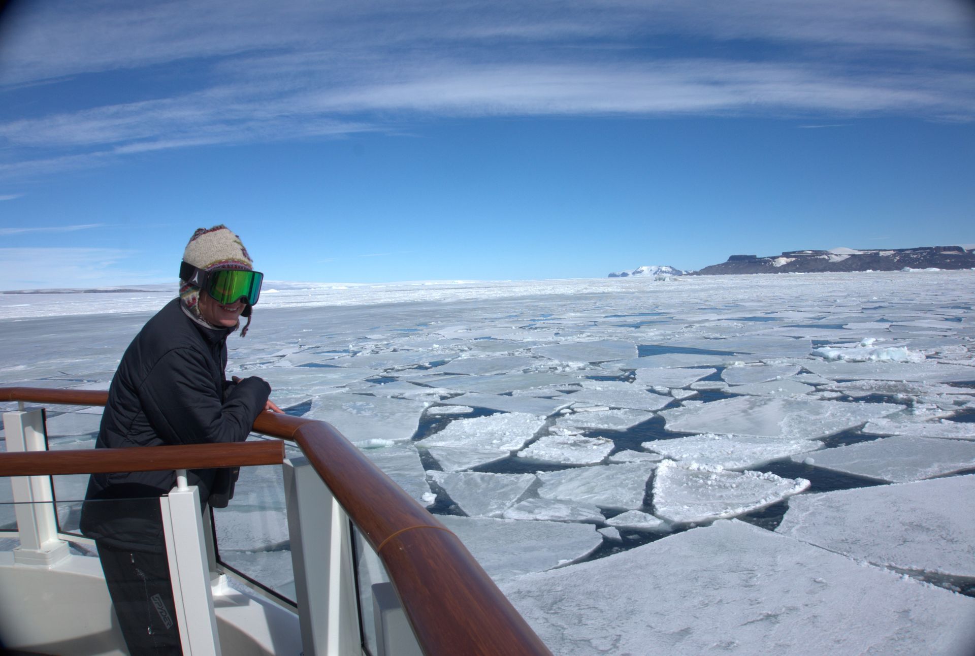 Jenny standing at bow of ship in antarctica