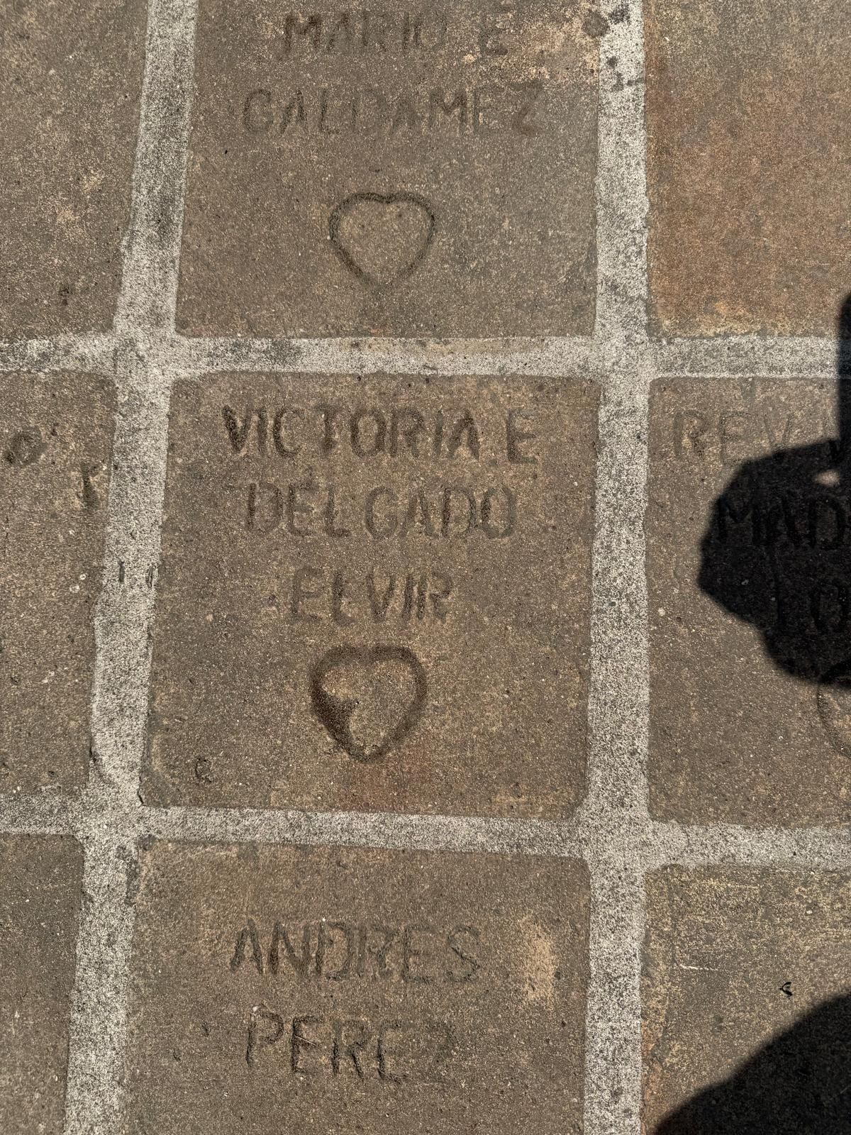 Stone tiles with names and carved hearts; 