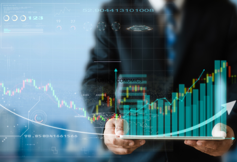 a man is holding a tablet with a graph on it .
