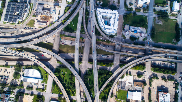 an aerial view of a highway intersection in a city .