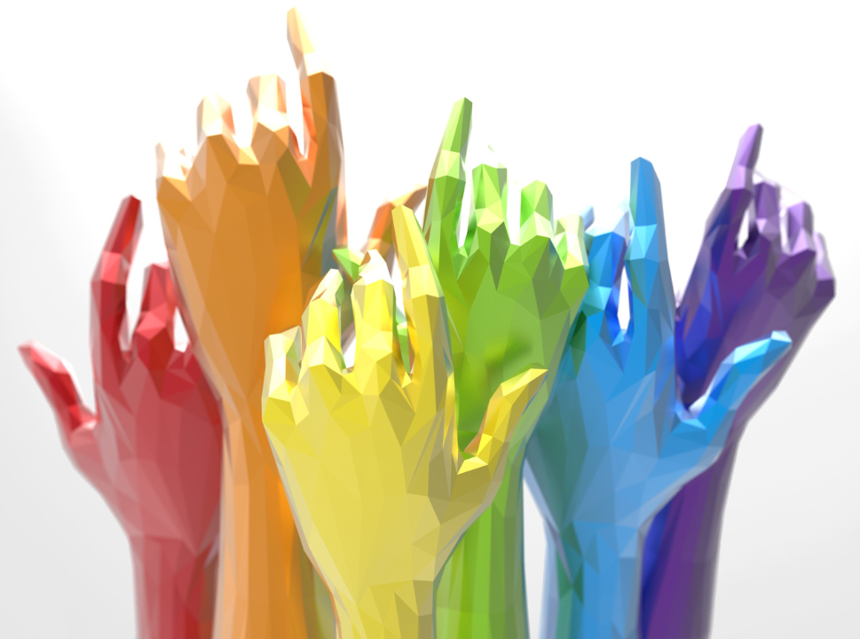 a group of colorful hands reaching up in the air .