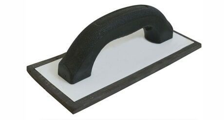 A Black and White Trowel With a Black Handle on a White Background — Northern Tile Gallery in Winnellie, NT