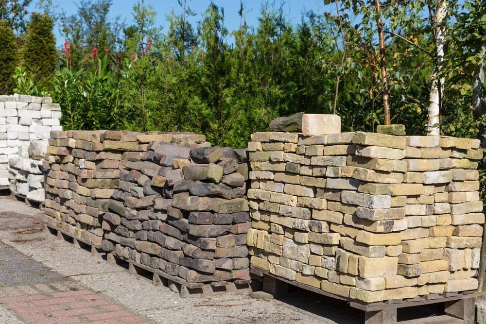 A Row of Bricks Stacked on Top of Each Other on Pallets — Northern Tile Gallery in Winnellie, NT