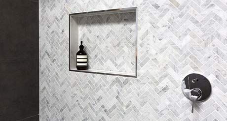 A Bottle of Soap is Sitting in a Niche in a Shower — Northern Tile Gallery in Winnellie, NT