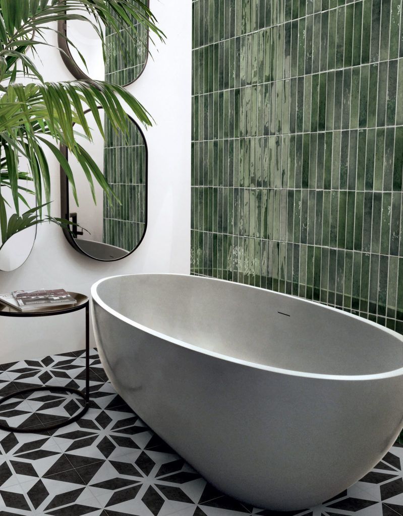 A Bathtub is Sitting in a Bathroom Next to a Mirror — Northern Tile Gallery in Winnellie, NT