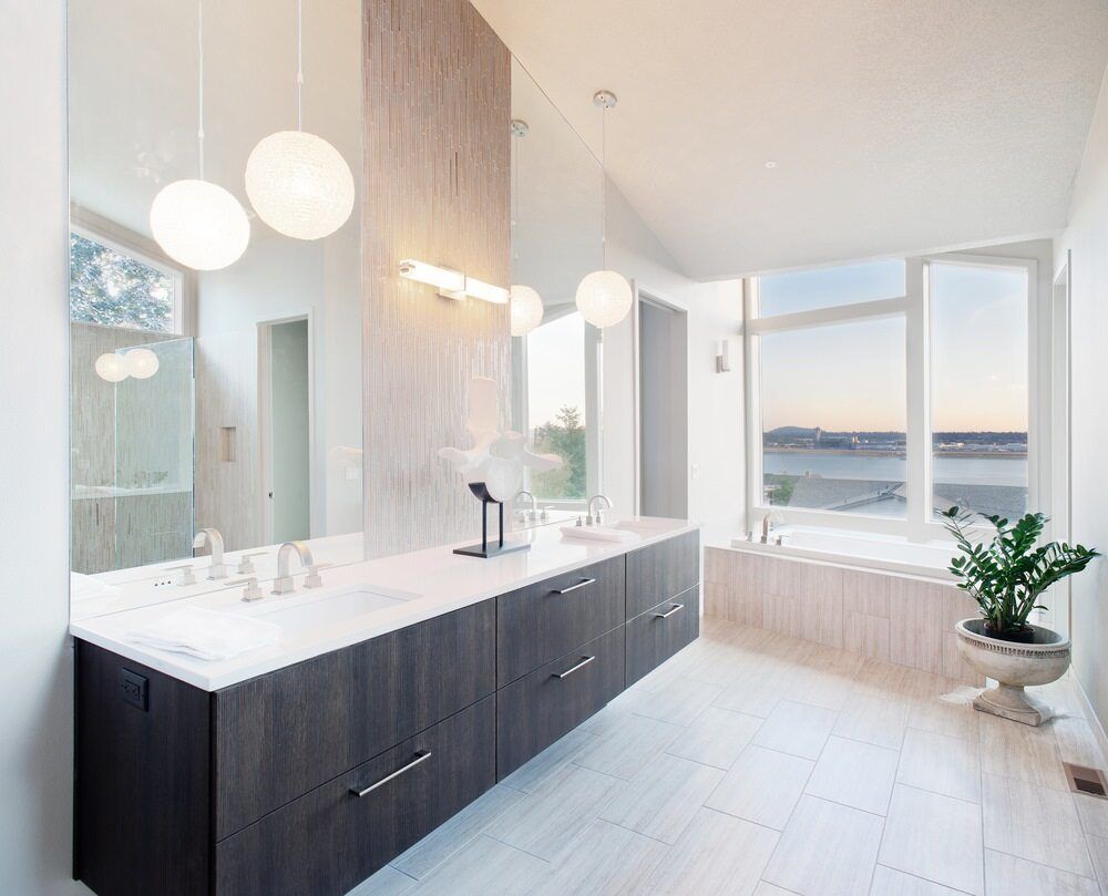 A Bathroom With Two Sinks, a Tub and a Large Mirror — Northern Tile Gallery in Winnellie, NT