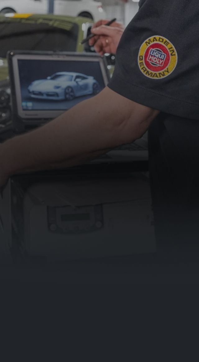 A car is being worked on in a garage | Adler Rennsport