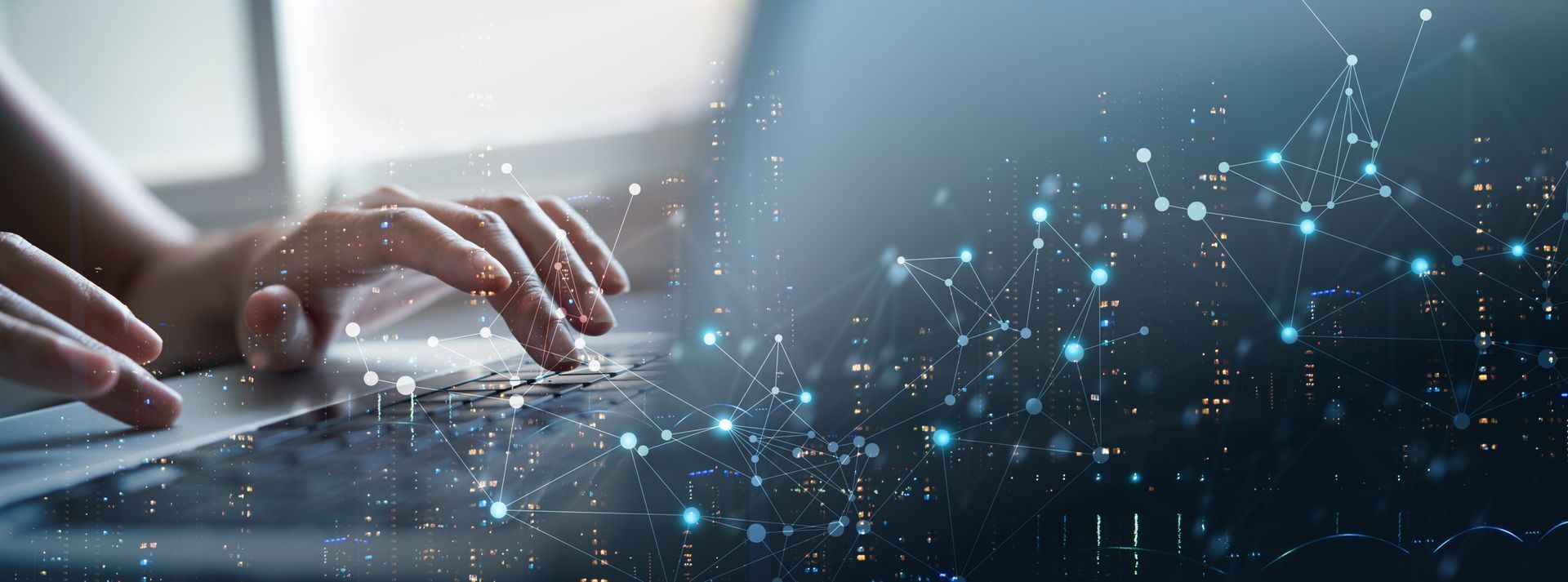 A person is typing on a laptop computer.