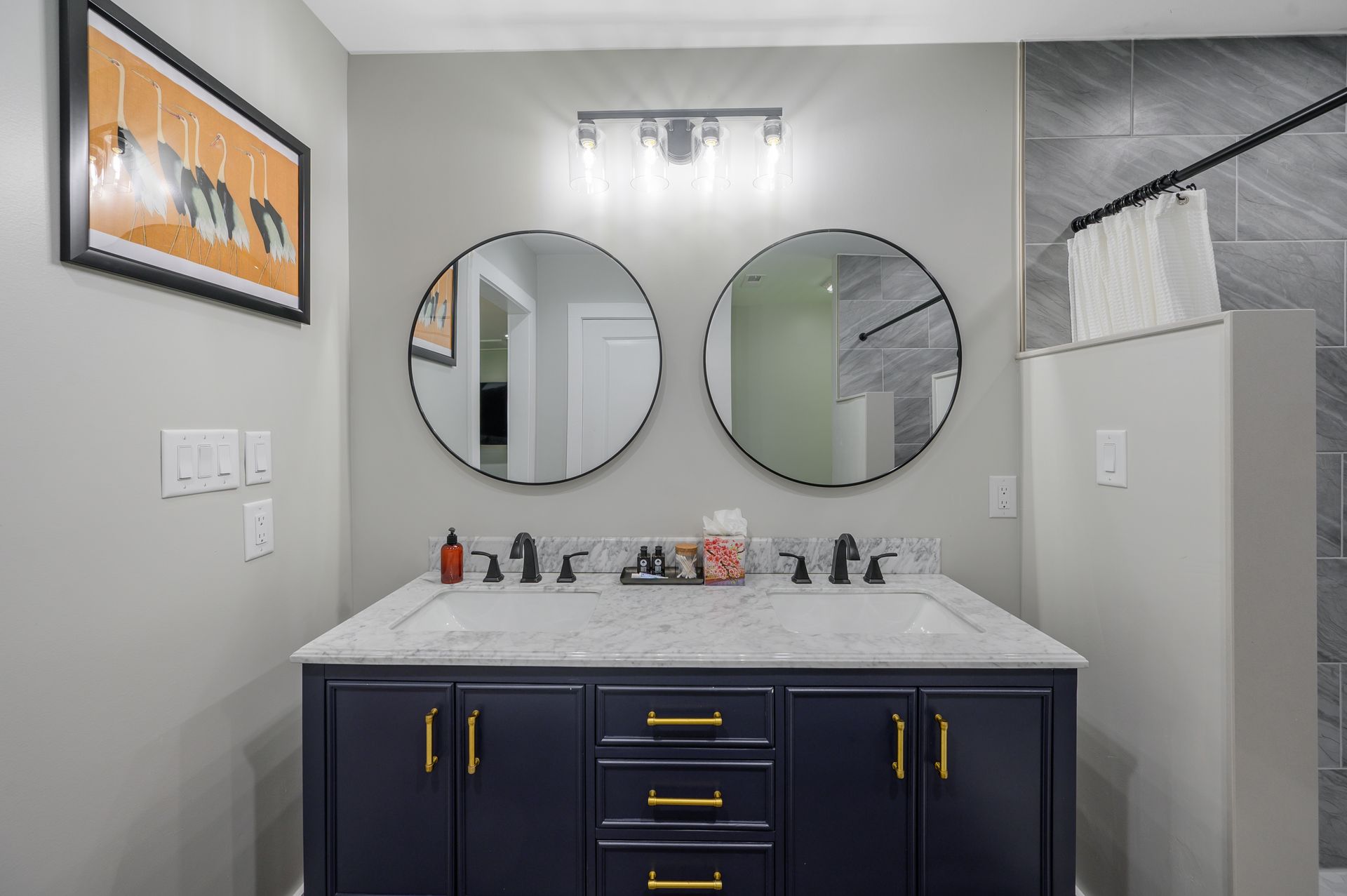 A bathroom with two sinks and two mirrors.