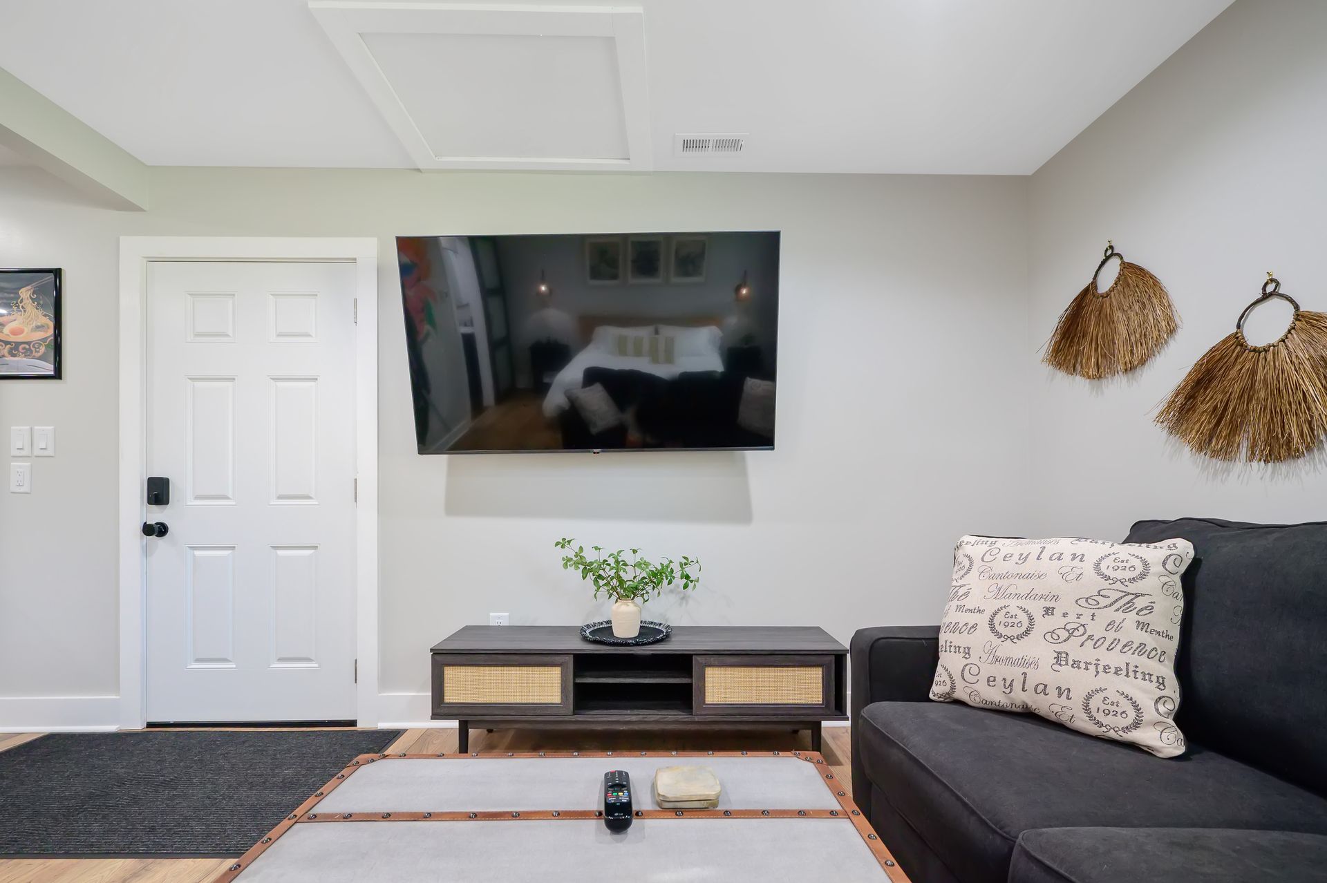 A living room with a couch and a flat screen tv