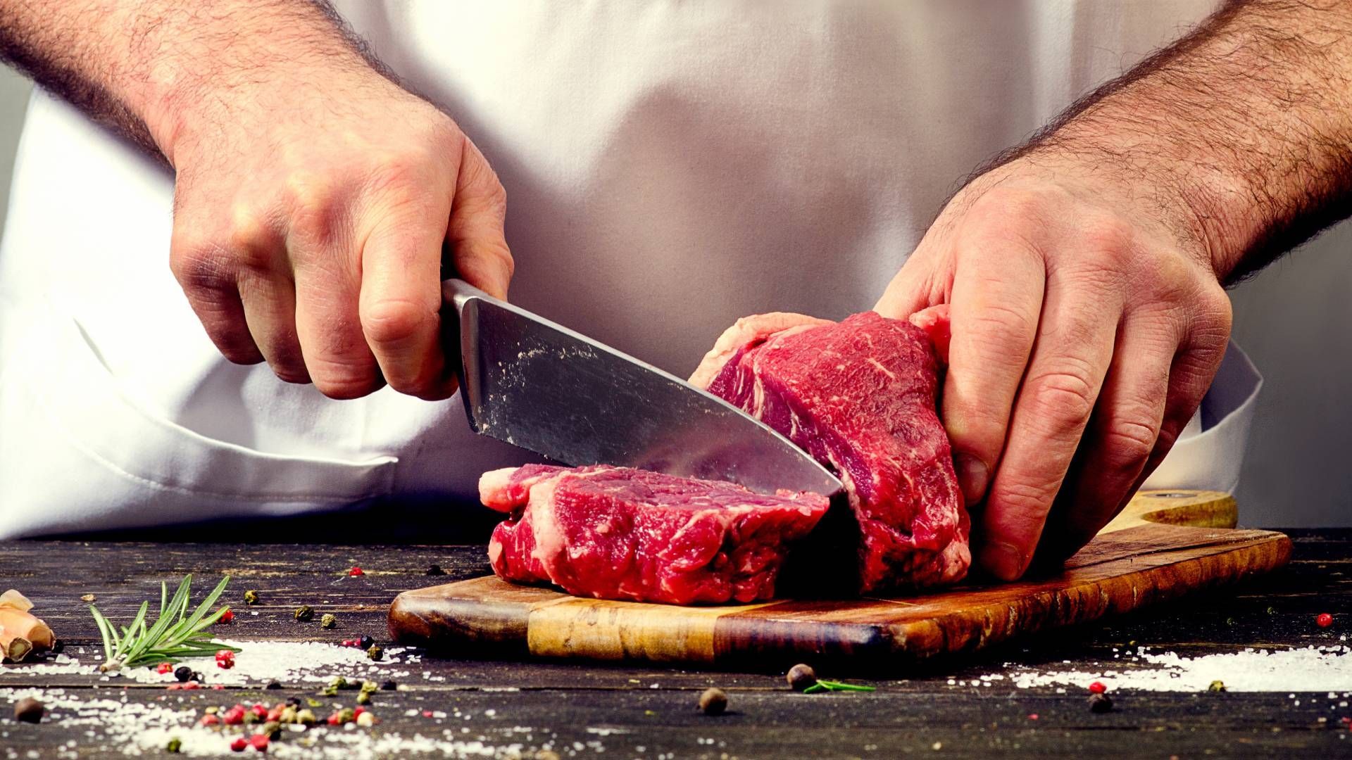 A local butcher near Carlisle, KY, cutting beef on a cutting board