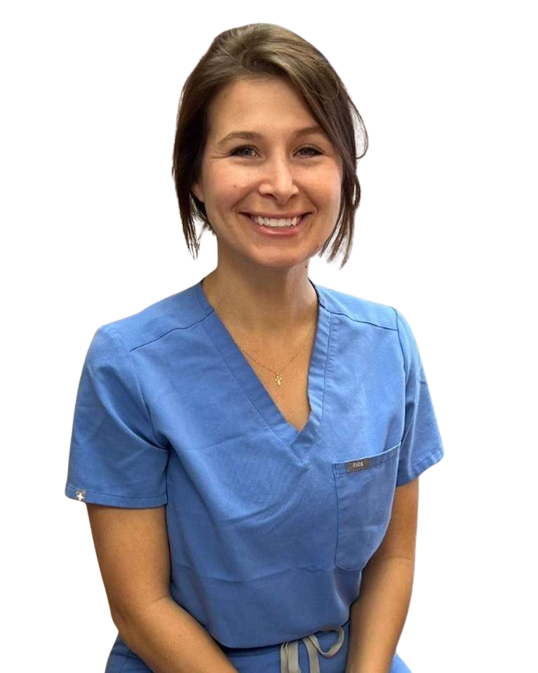 A woman in a blue scrub top is smiling for the camera