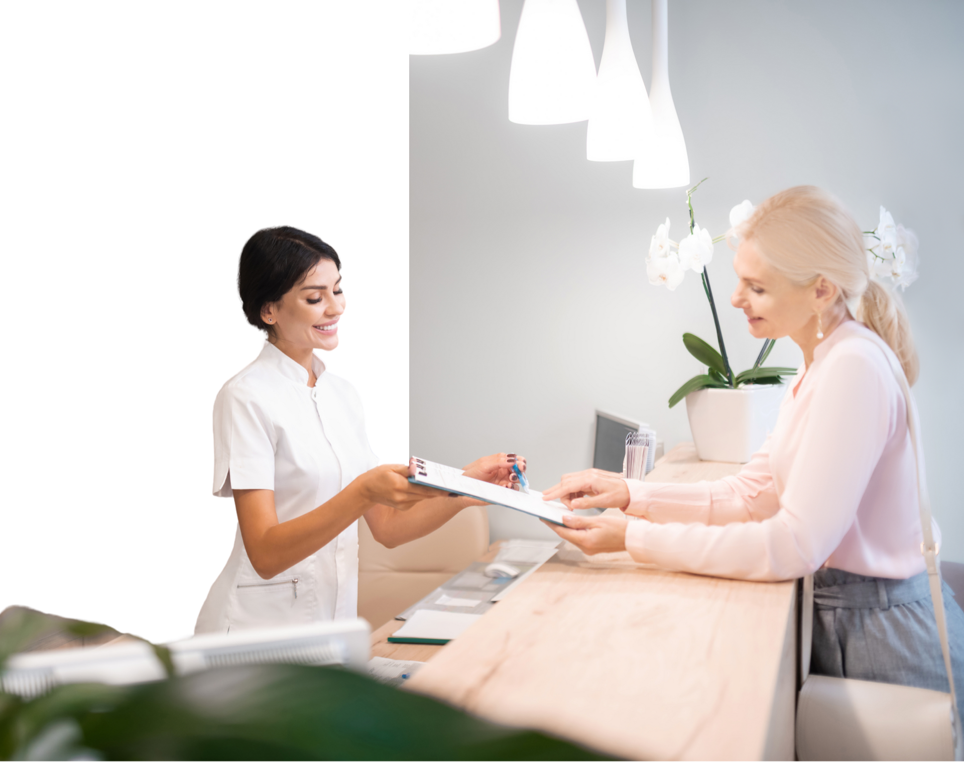 A nurse is giving a clipboard to a patient at a dental office.