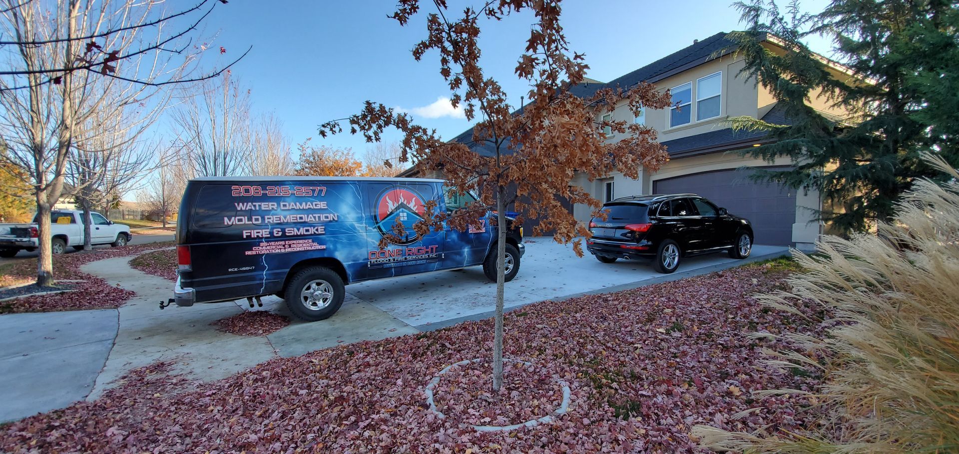 A van is parked in front of a house.