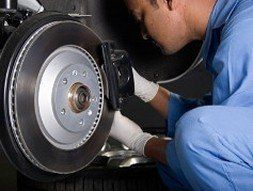 Mechanic working on car tire - Gedney Auto Service in White Plains, NY