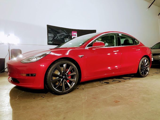 a white lamborghini is parked in a lobby of a hotel .