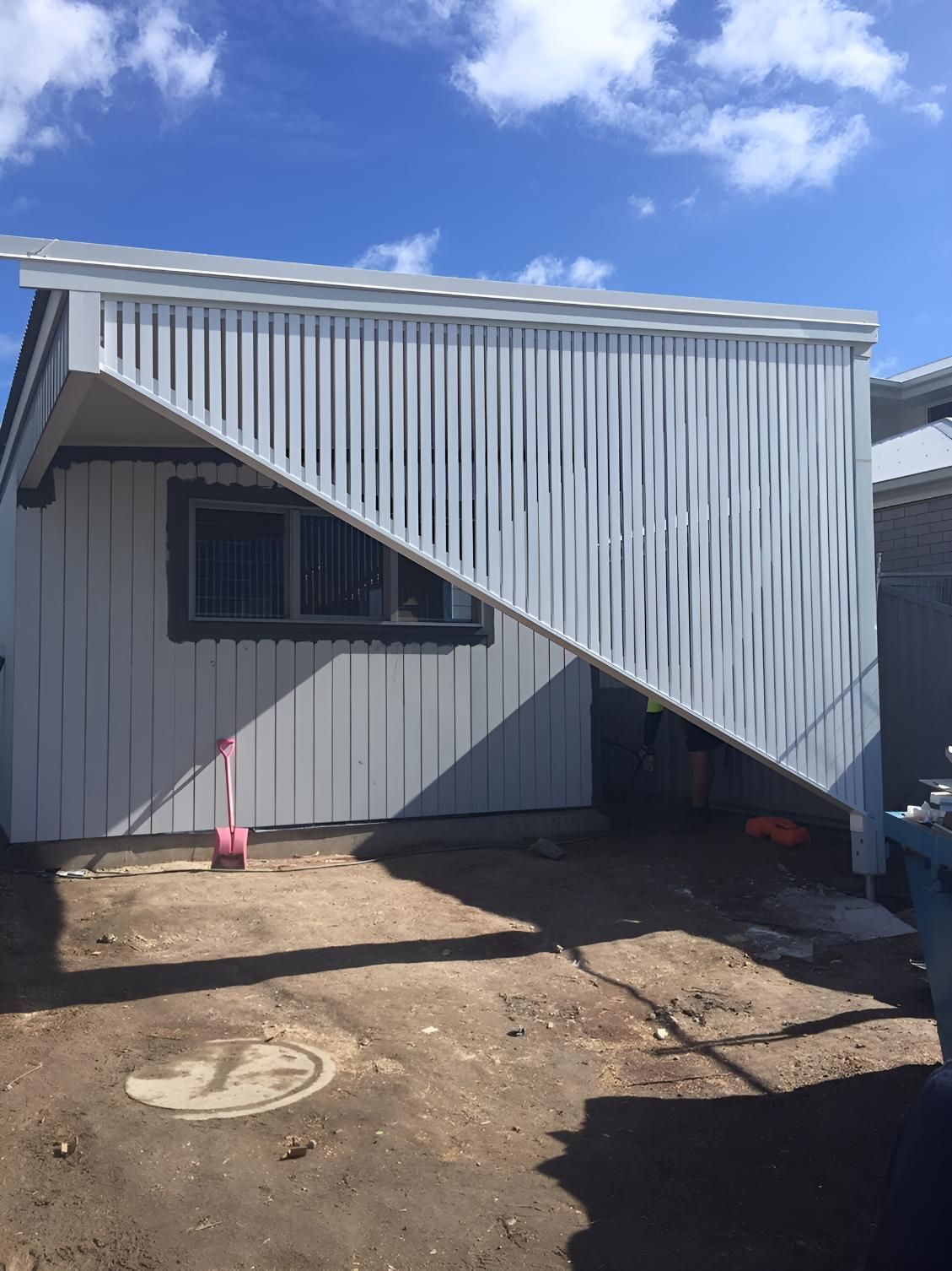 A White House With a Staircase Leading Up to It — Simmweld Metal Fabrication and Welding In South Murwillumbah, NSW