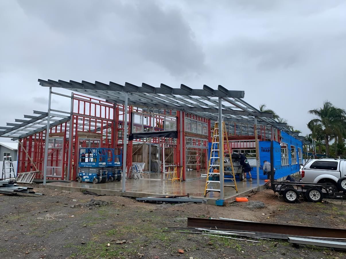A Large Building is Being Built in a Dirt Field — Simmweld Metal Fabrication and Welding In South Murwillumbah, NSW