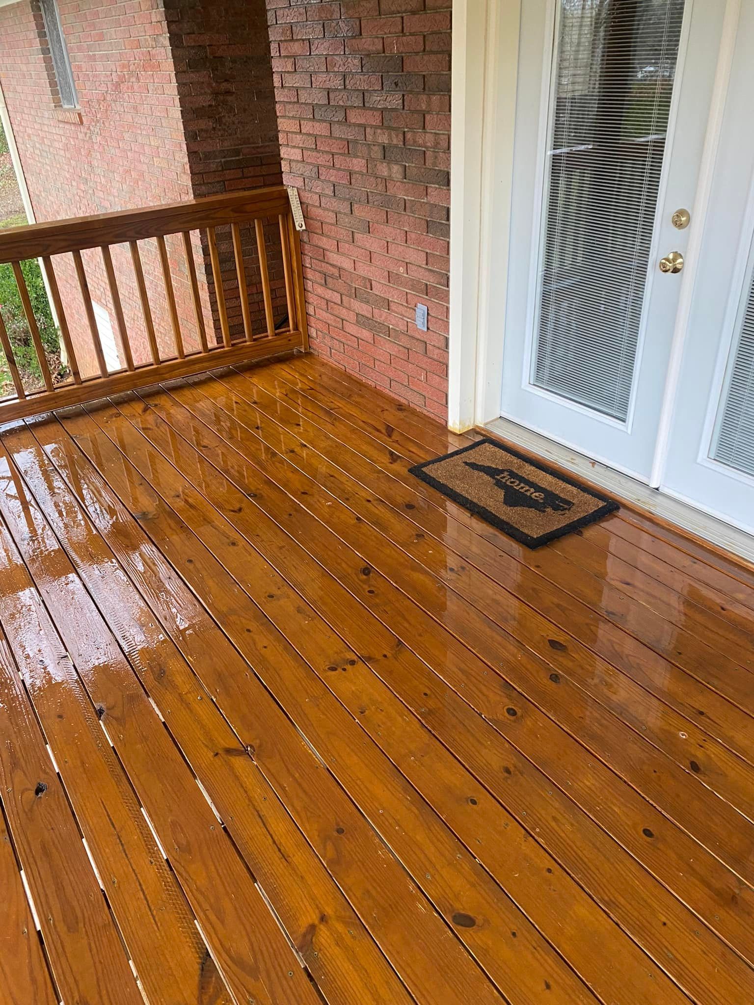 Polished wood deck surface restored through deck and fence cleaning services