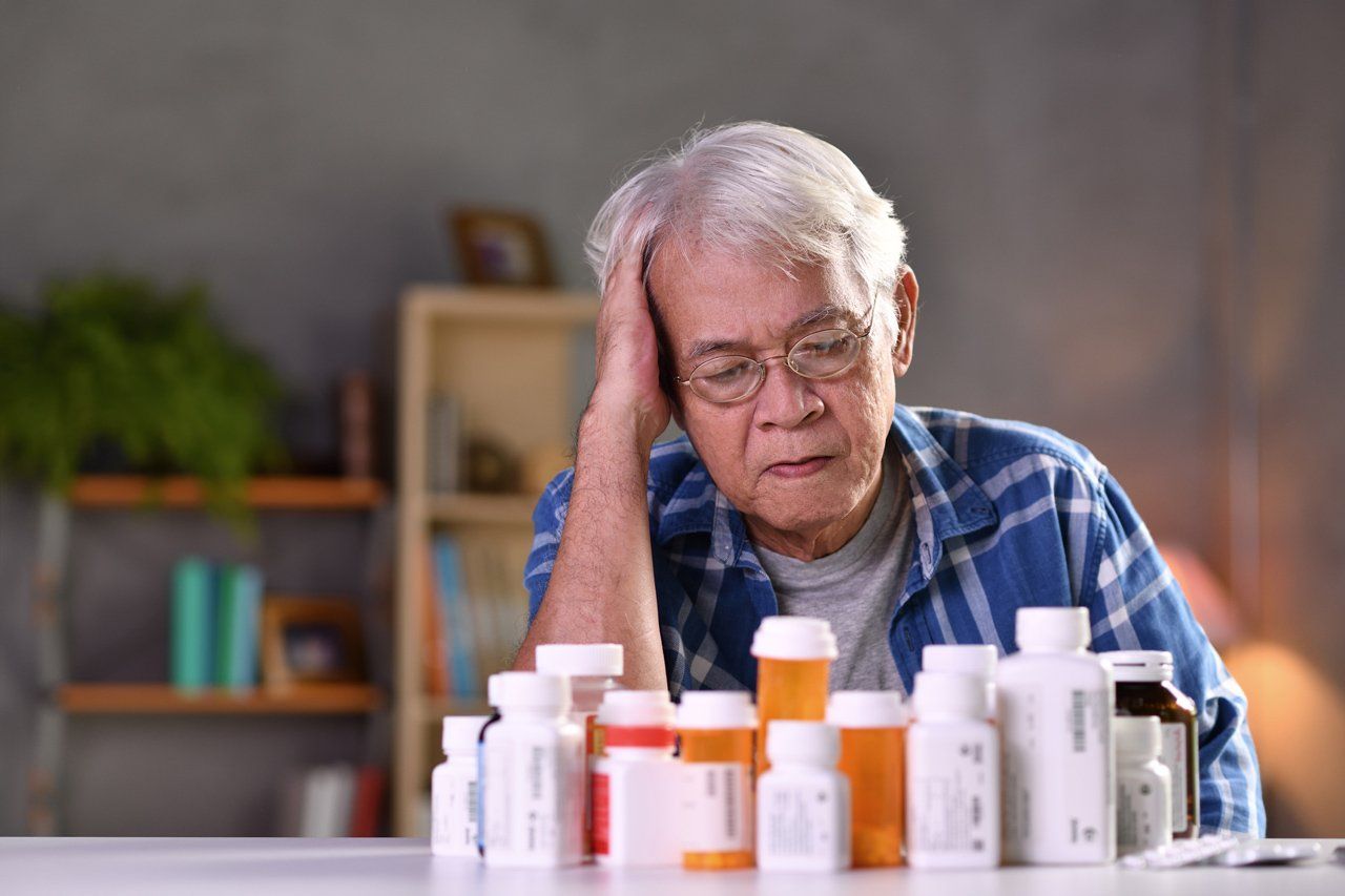 Old Man Looking in Medicines — Keansburg, NJ — Keansburg Pharmacy