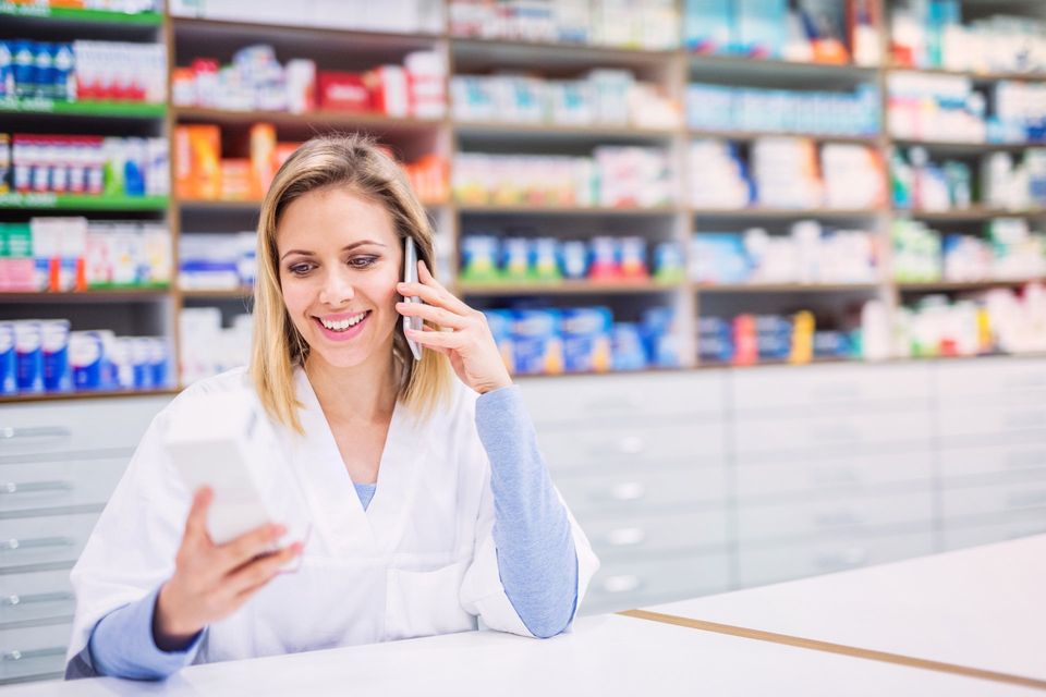 Online RX Refill — Female Pharmacist With Smartphone in Keansburg NJ
