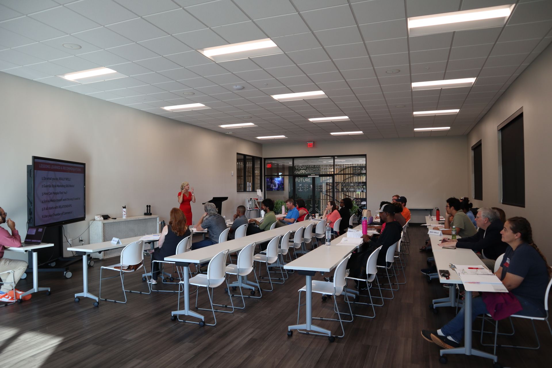A group of people are listening to a presentation