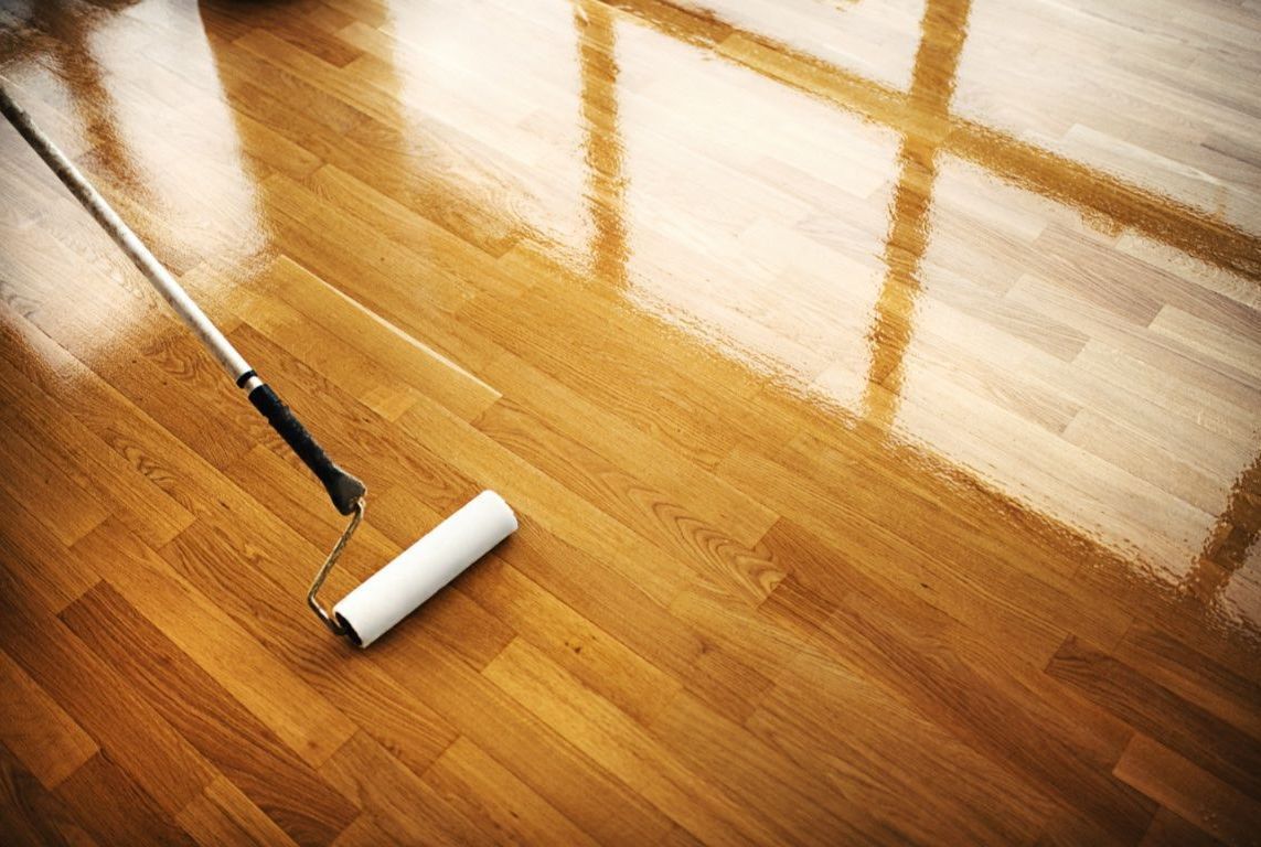 Apply a top-coat at the end of a hardwood floor refinishing project
