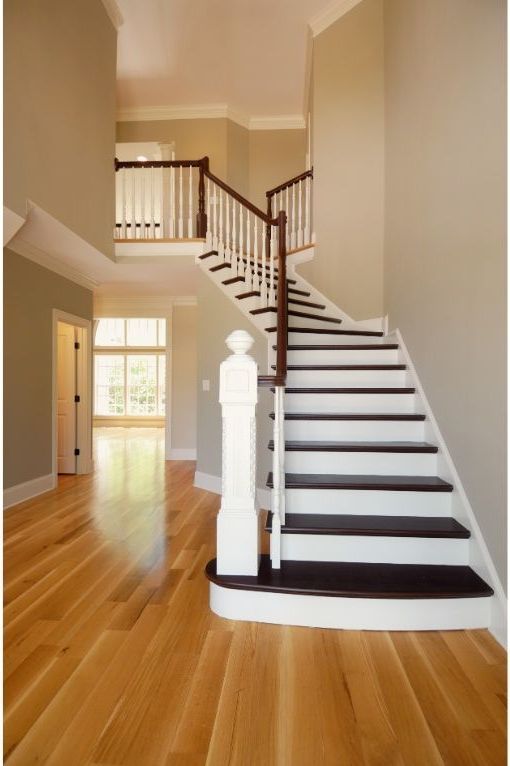 Image of beautiful two-tone hardwood staircase in new home in Worcester, MA