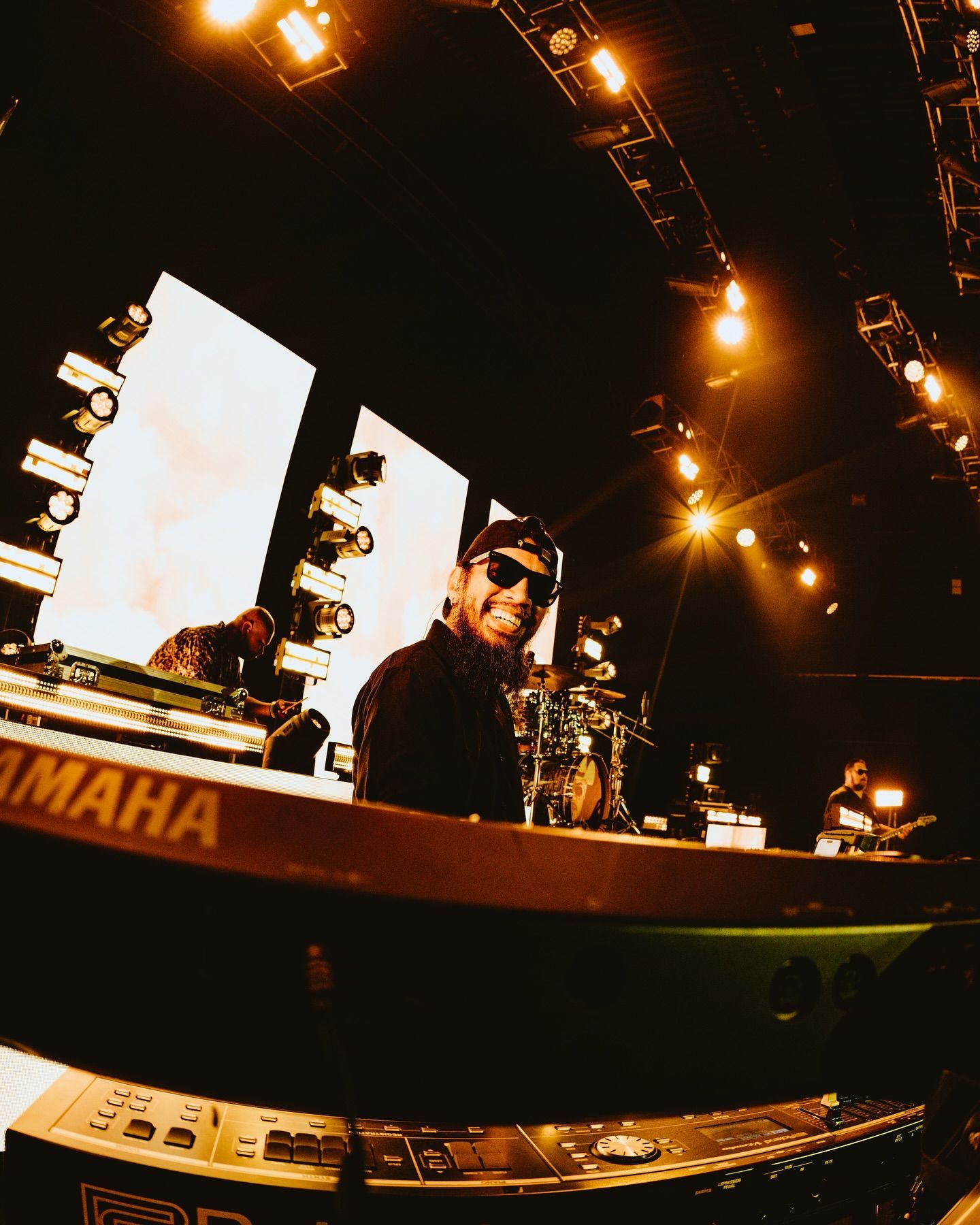 A man playing a yamaha keyboard on a stage