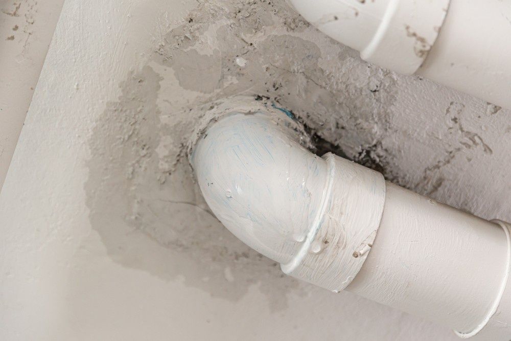 A White Pipe with A Water Leakage — Aqua Blue Plumbing Services in Nambucca Heads, NSW