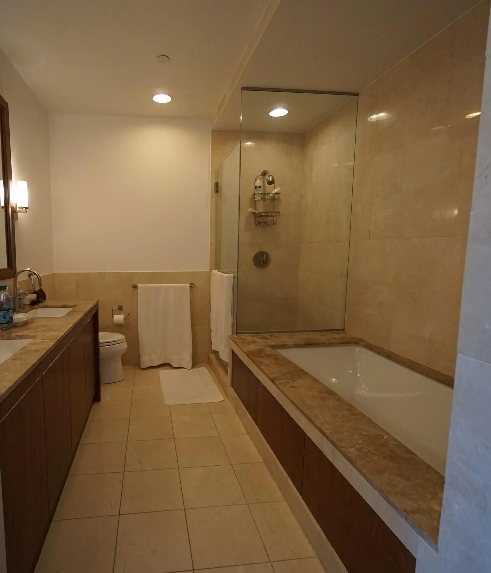 A Bathroom with A Tub, Toilet, Sink and Shower — Aqua Blue Plumbing Services in Coffs Harbour, NSW 