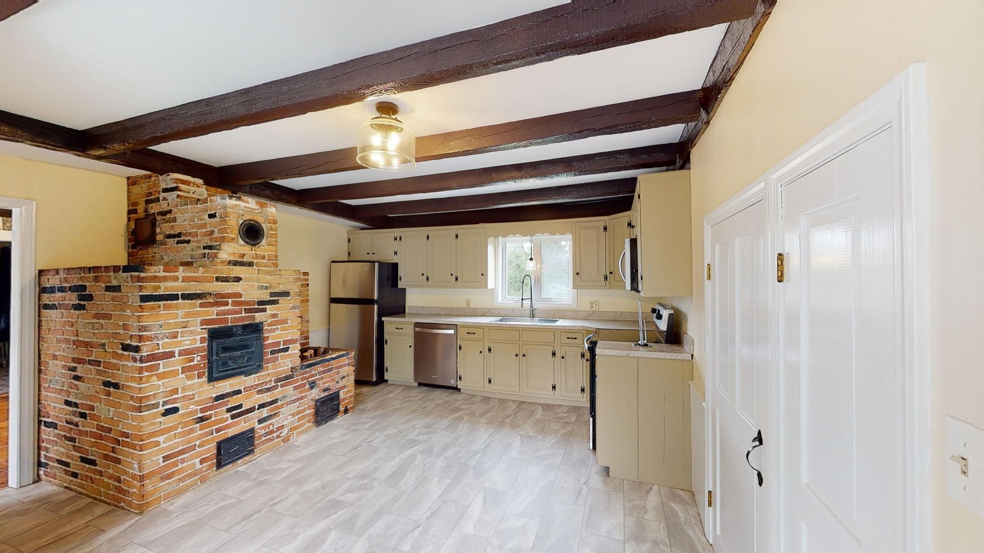 There is a brick oven in the middle of the kitchen.