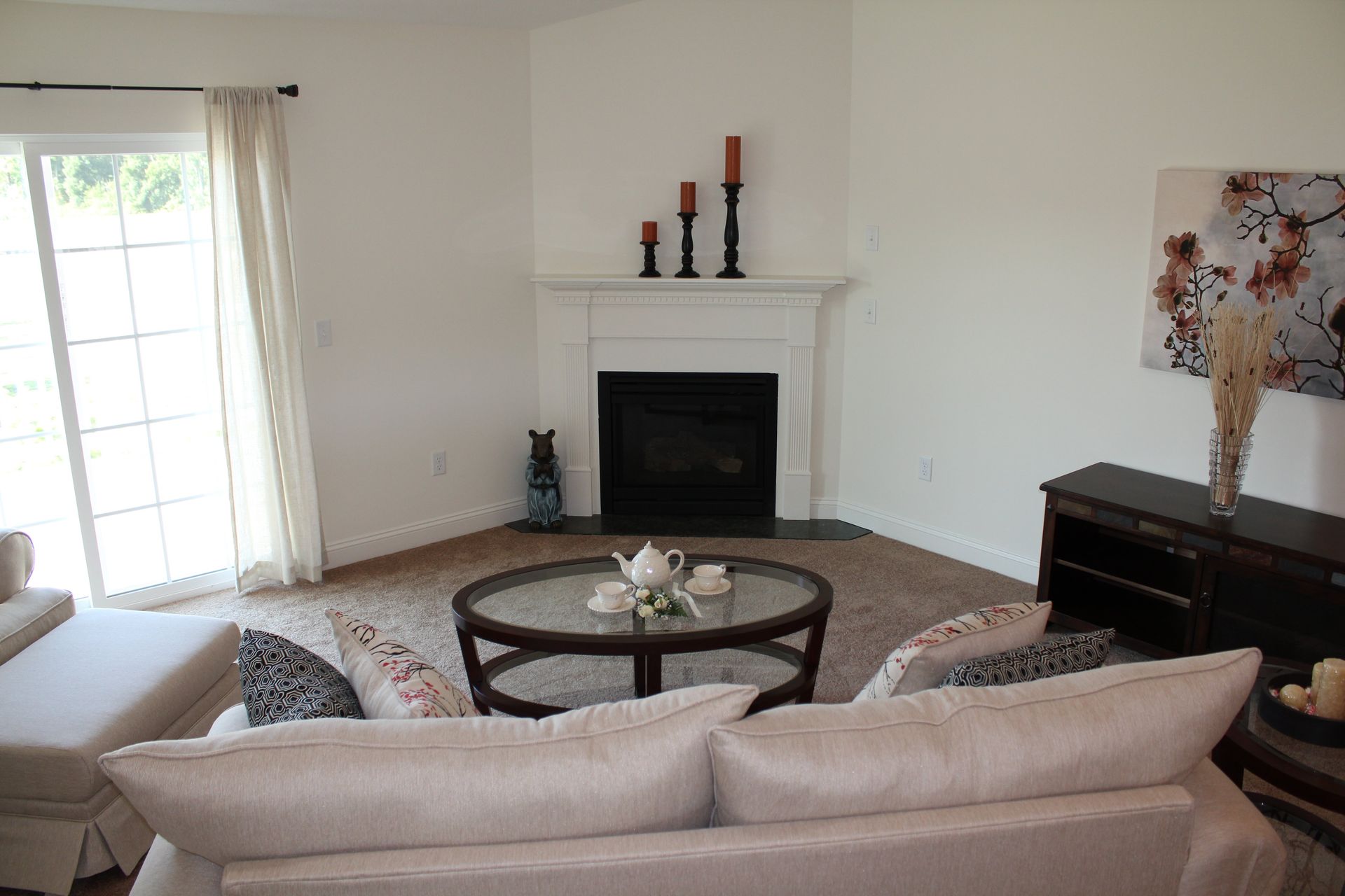 A living room with a fireplace and a couch
