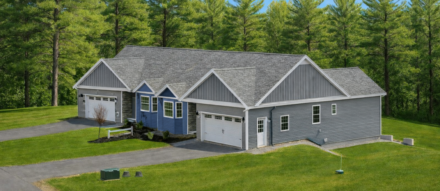 Rendering of a Gray 2-unit house with garage doors on a grassy lot, surrounded by pine trees under a blue sky.