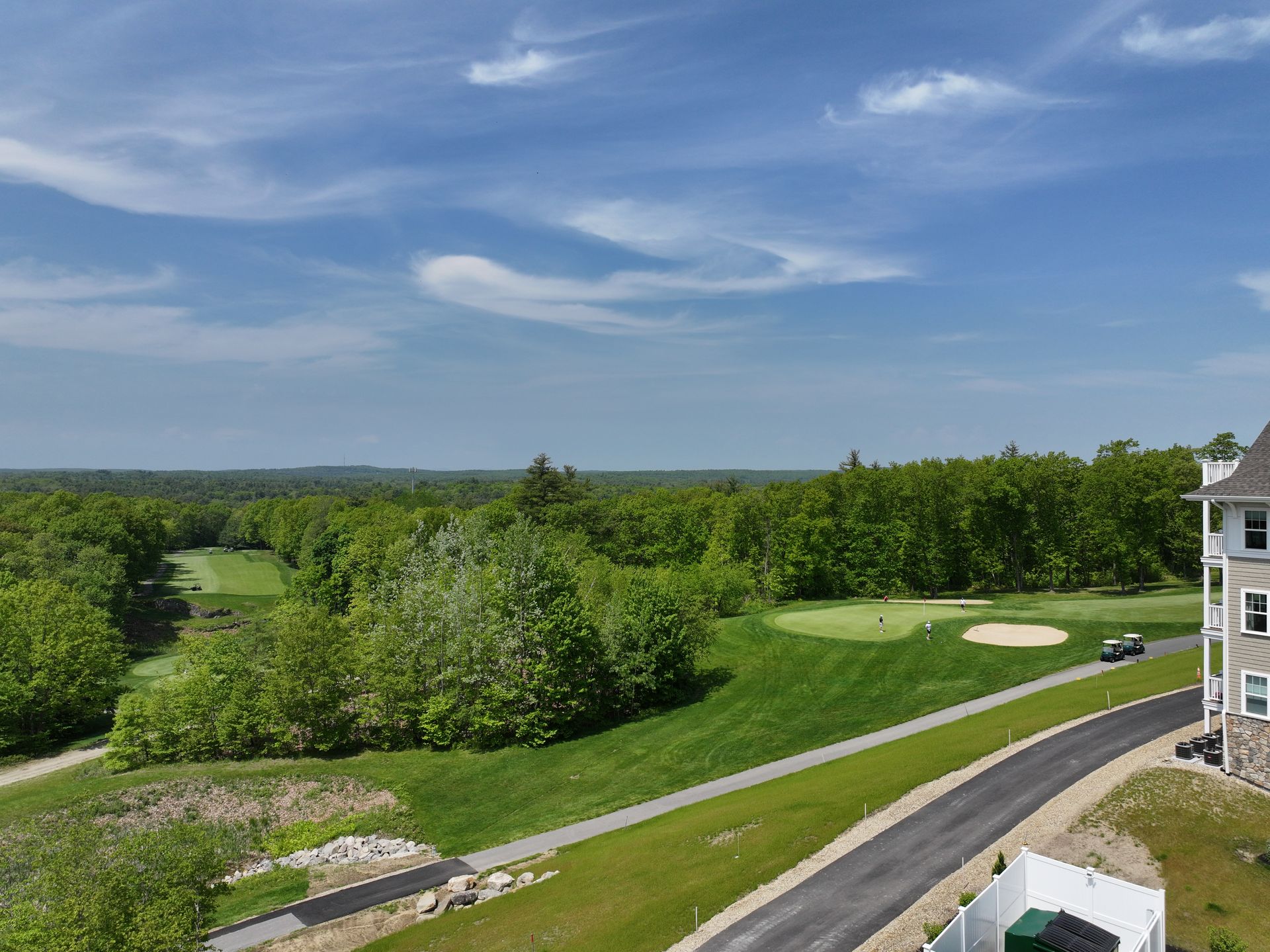 A view of a golf course from a balcony.