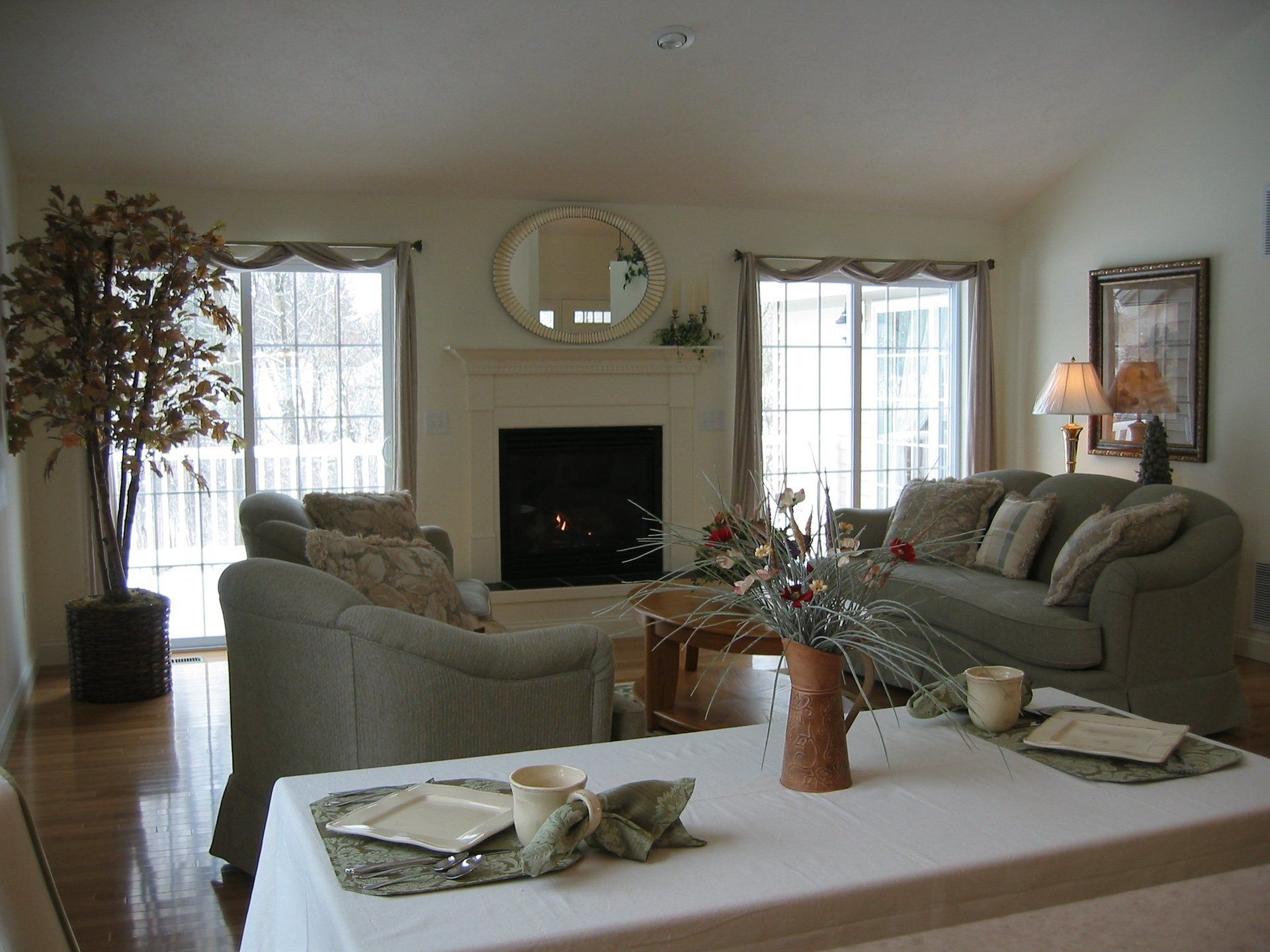 A living room filled with furniture and a fireplace