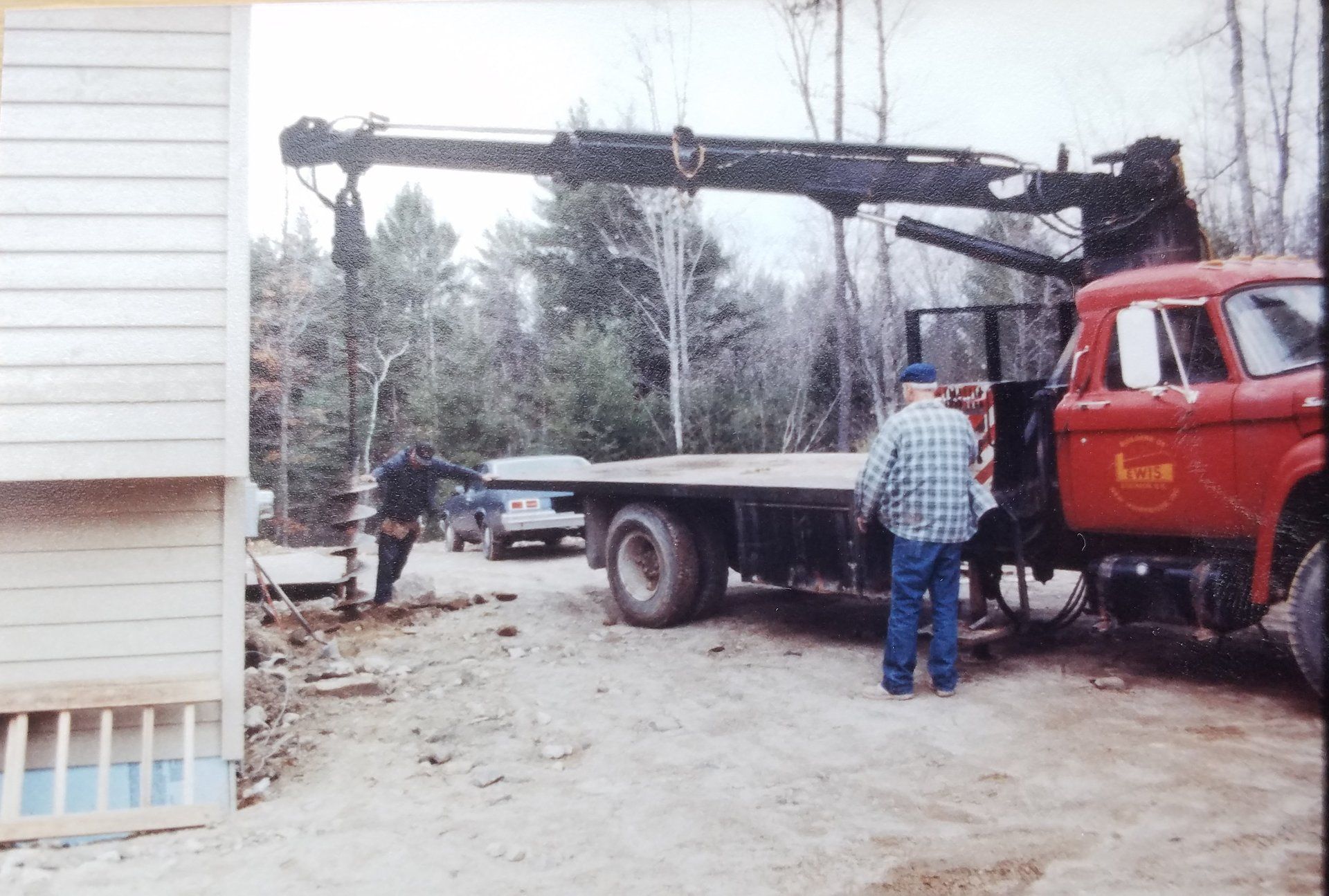 Vintage Lewis Builders truck and workers