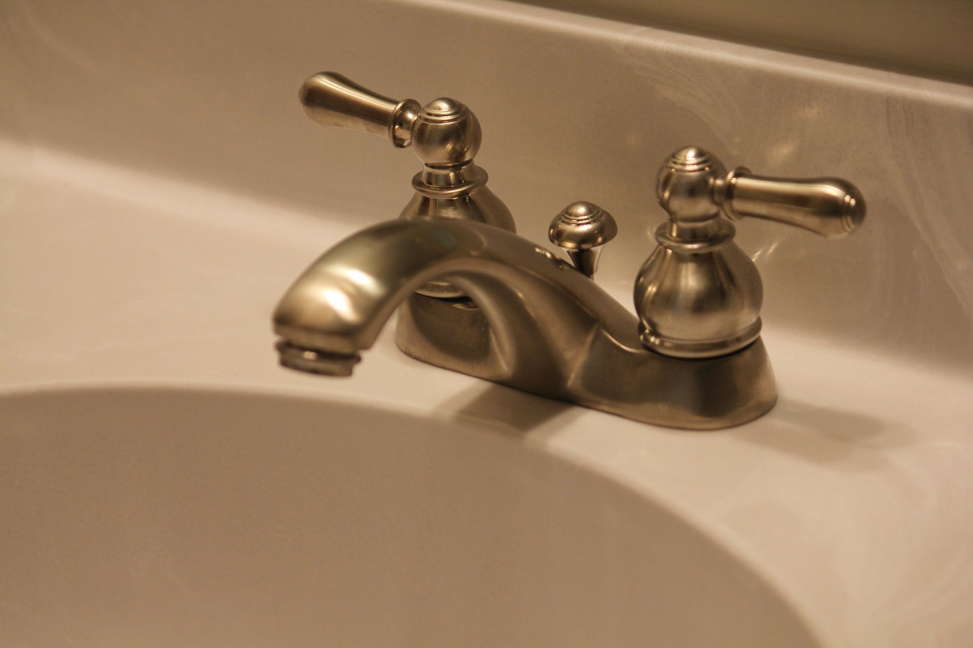 A close up of a faucet on a bathroom sink